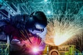 IndustrialÃ¢â¬â¹ workerÃ¢â¬â¹ weldingÃ¢â¬â¹ proceccÃ¢â¬â¹ byÃ¢â¬â¹ arcÃ¢â¬â¹ withÃ¢â¬â¹ sparksÃ¢â¬â¹ lightÃ¢â¬â¹ inÃ¢â¬â¹ factoryÃ¢â¬â¹ Royalty Free Stock Photo